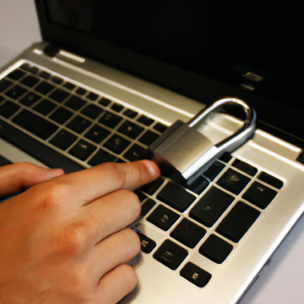 Person using laptop with lock